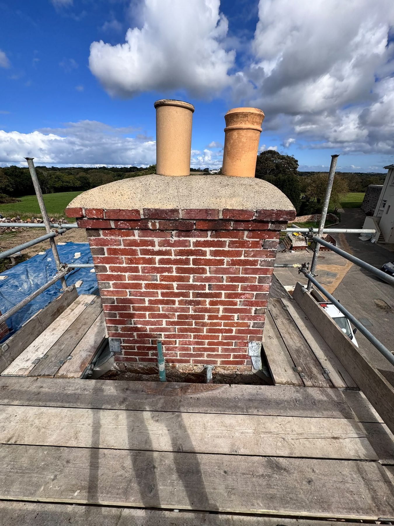 Scaffold access around a chimney